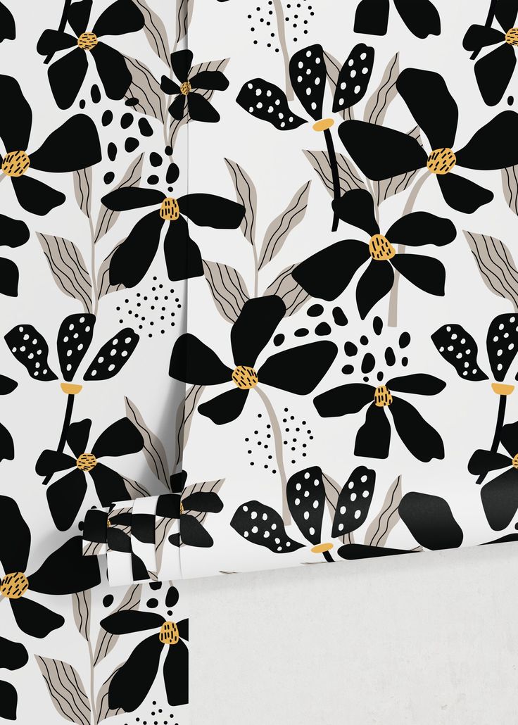 black and white floral wallpaper with gold accents