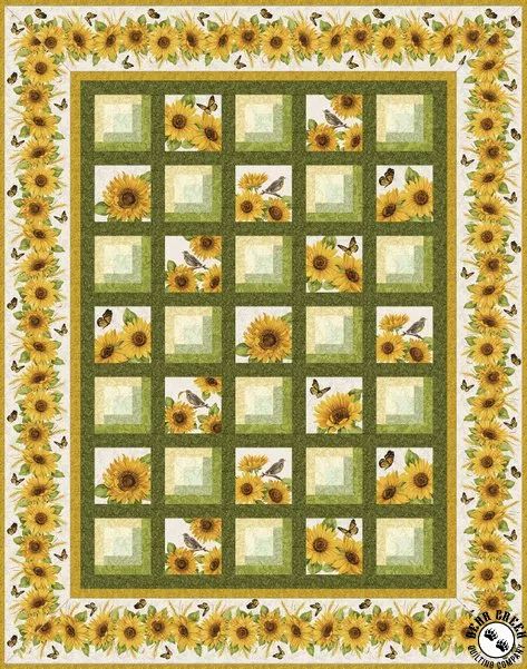 a quilt with sunflowers and bees in the center, on a green background