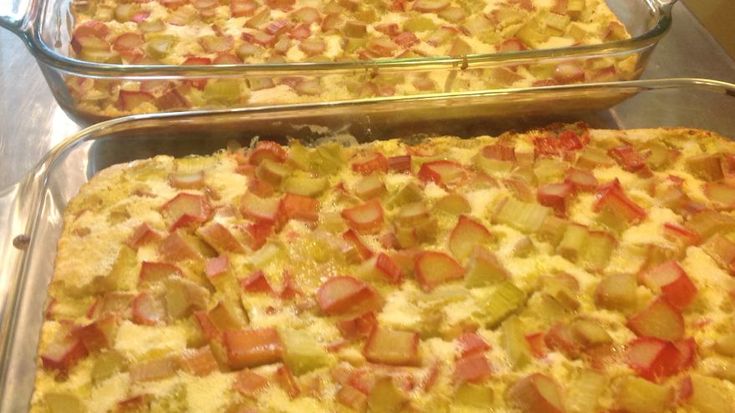 two pans filled with food sitting on top of a counter