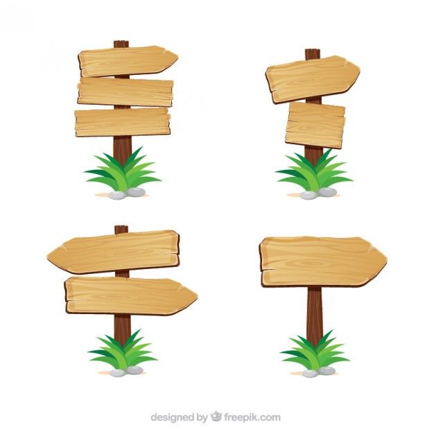 four wooden signs with grass on them