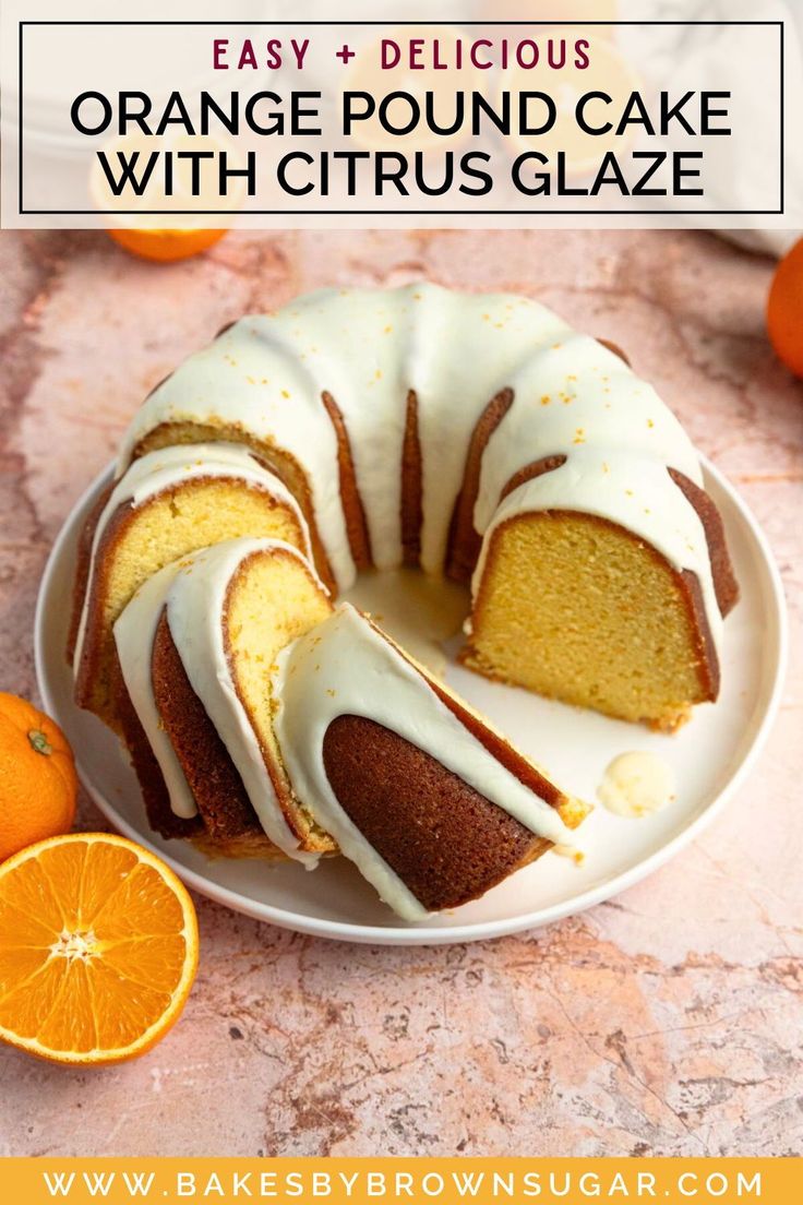 orange pound cake with citrus glaze on a white plate next to an orange slice