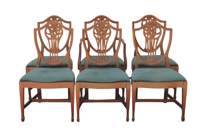 a set of four chairs with blue upholstered seats