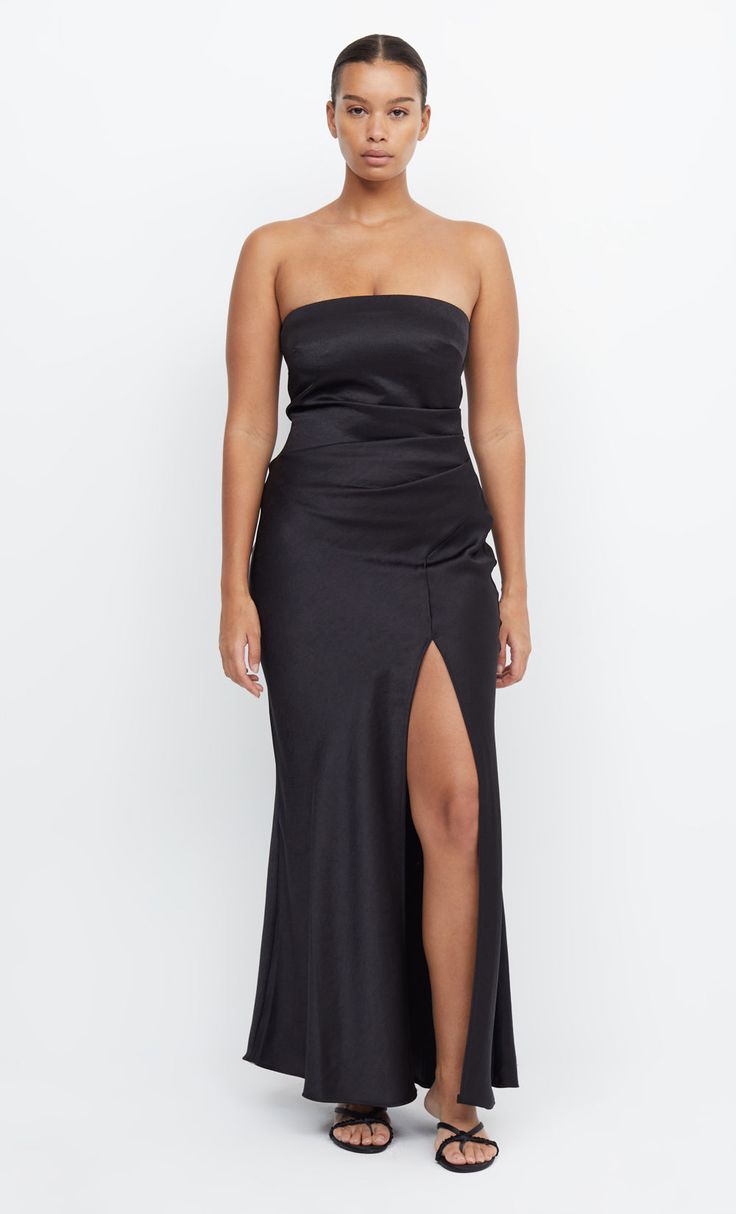 Dreamer Strapless Maxi Bridesmaid Formal Dress in Black by Bec + Bridge Sleek Maxi Dress With Straight Neckline, Sleek Prom Dress With Side Slits, Strapless Maxi Dress With Side Slits For Prom, Evening Maxi Dress With Fitted Bodice And Split, Strapless Evening Dress With Side Slits, Black Satin Full-length Maxi Dress, Sleek Maxi Dress With Straight Neckline For Date Night, Sleek Ruched Maxi Dress, Fitted Bodice Maxi Dress With Side Slits