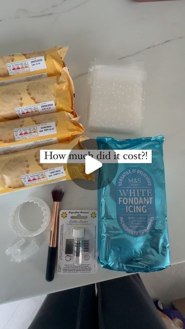 the contents of a makeup bag are displayed on a table with text that reads how much did it cost?