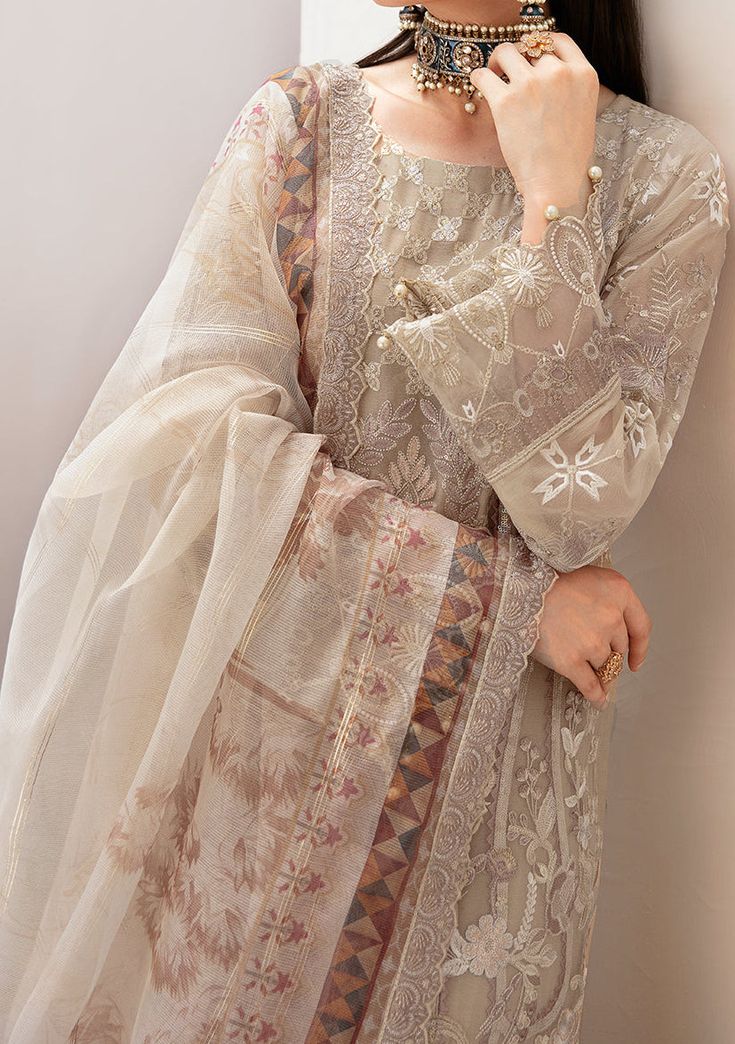 Introducing our Chiffon collection DASTAN by Ramsha designed to make you look and feel your best These pieces will add a touch of class and elegance to your wardrobe. This collection is a beautiful collection of ensembles offering versatile compositions for the latest festive wardrobe requirements. Embroidered Chiffon Front With Sequence. Embroidered Chiffon Back and Sleeves. Embroidered Organza Lace. Embroidered Organza Ghera, and Trouser Lace. Embroidered Net Dupatta. Raw Silk Trouser. Color: There might be slight color variation due to lighting and flashes while the photo shooting. The color may also vary because of different screen resolutions. Wash Care: Dry Clean Only. Velvet Anarkali, Batik Print Dress, Salwar Suits Party Wear, Indian Anarkali, Saree Sale, Lehenga Jewellery, Block Dress, Lehenga Style, Jamdani Saree