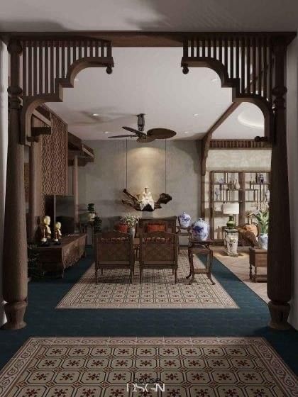 an archway leading to a living room with blue carpeting and wooden furniture on either side