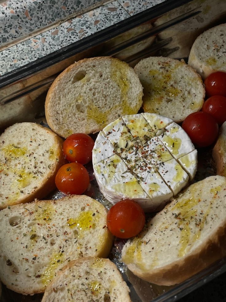 some bread and tomatoes are in a container