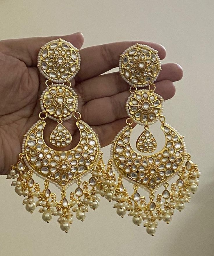 Tyaani inspired Ahmedabadi Kundan big Chand Bali in the Gold finish/Diamond Jhumki/Indian Jhumka/CZ Jhumka/Pakistani Jewelry/Celebrity Earring.  This designer charming Kundan big Chand Bali jhumka is neat and simple for those who wish for light jewelry. Match this jewelry with any of your outfits and flaunt your style. Luxury Gold Jhumkas For Navratri, Luxury Heavy Jhumkas For Diwali, Luxury Jeweled Chandbalis For Wedding, Luxury Heavy Chandbalis For Party, Luxury Chandbalis For Formal Occasions, Temple Style Chandelier Earrings With Stone Work For Celebrations, Temple Jewelry Style Chandelier Earrings For Celebration, Round Kundan Necklace With Latkans For Festivals, Festival Kundan Necklace With Latkans