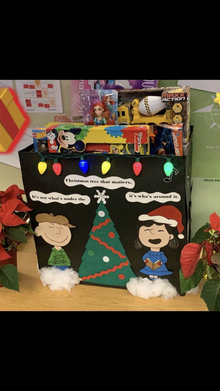 a black bag decorated with christmas decorations and cartoon characters on the front, sitting on a table