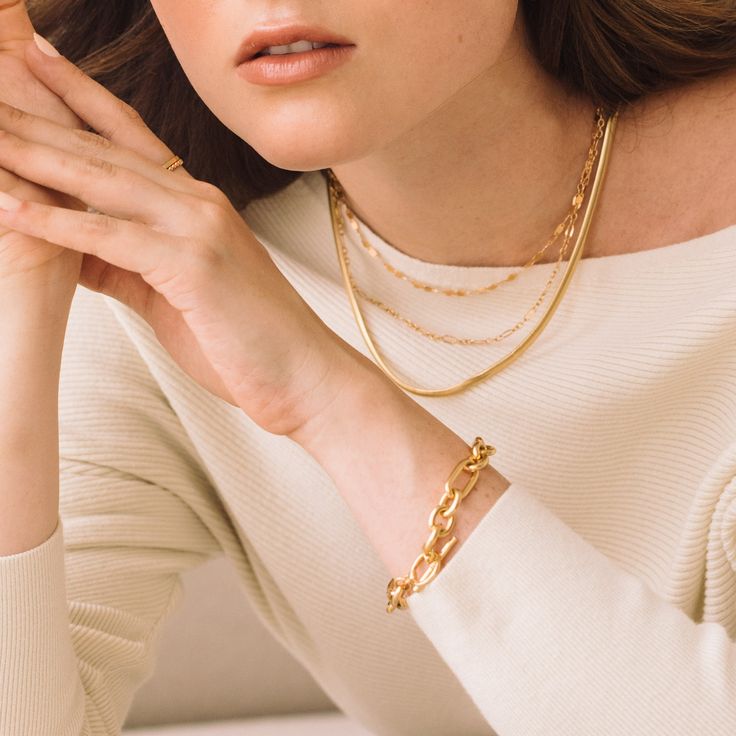 Feel beautiful wearing our Monroe Toggle Bracelet, crafted from a luxe link chain with an easy toggle closure. Dare to stand out wearing the perfect balance of contemporary and classic style in gold. Make the Monroe Toggle Bracelet your signature accessory and be surprised by the endless compliments you receive. Dare to shine with Monroe. Available in 14k gold plated brass 7" link chain 1/2" toggle closure SKU: BYB1171 Elegant Metal Toggle Necklace, Tarnish Resistant, Elegant Metal Toggle Necklace Tarnish Resistant, Modern Gold Chain Necklace For Everyday, Classic Toggle Necklace For Everyday, Adjustable Timeless Chain Bracelet, Chunky Chain Oval Link Bracelet, Classic Gold Toggle Necklace For Everyday, Classic Everyday Toggle Necklace With Adjustable Chain, Timeless Tarnish Resistant Chain Necklace