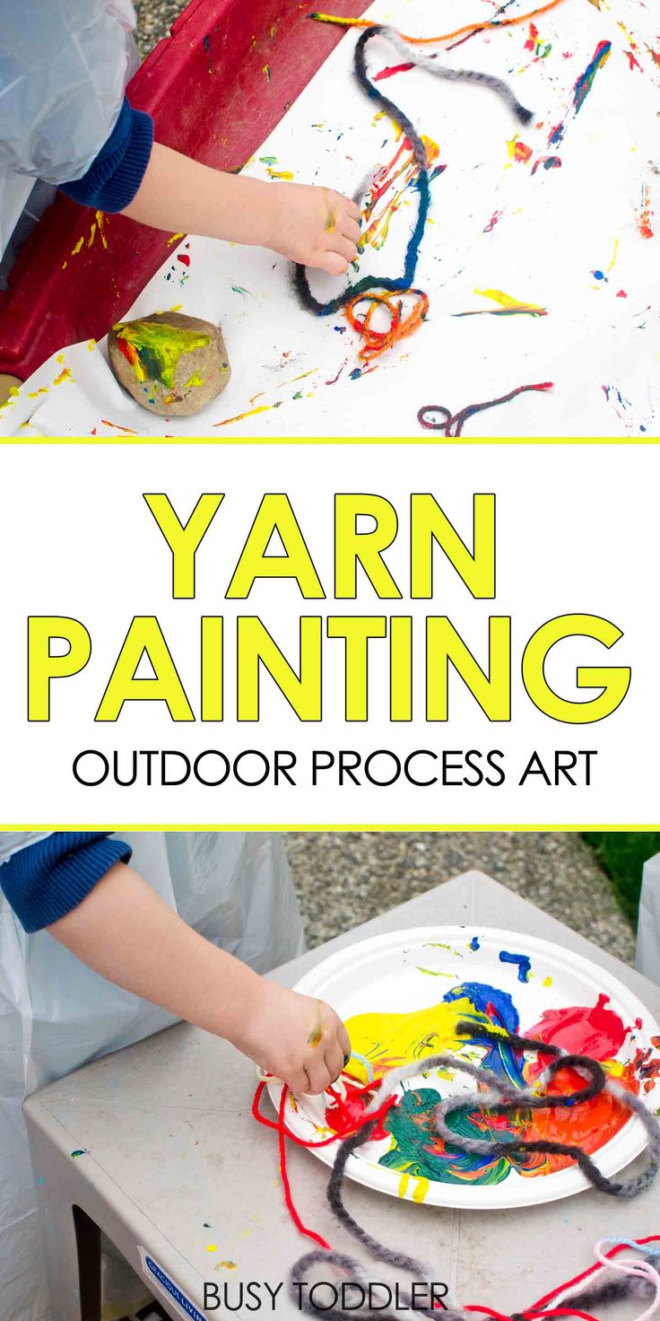 a young boy is painting on a paper plate