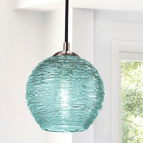 a glass light hanging from a ceiling in a room