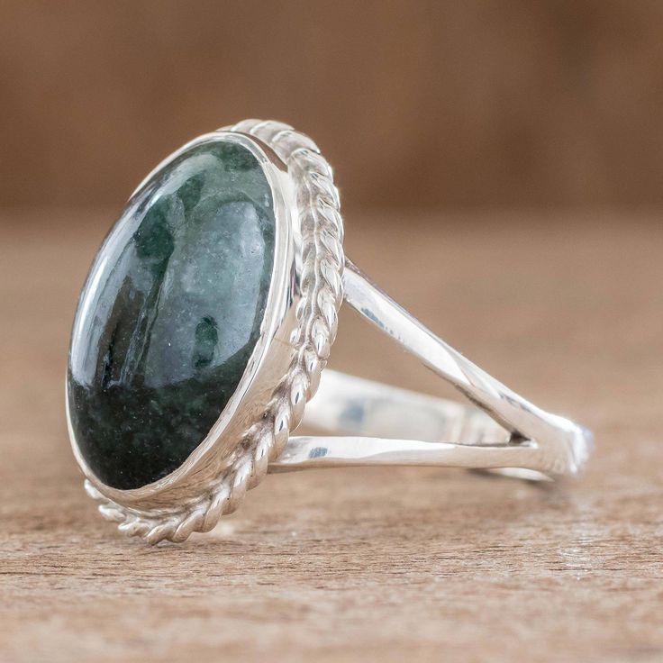 The sterling braiding around the gem gives it a classier more elegant look say the Jimenez Family as they present their new design. The collection highlights the inherent beauty of natural jade stone of immortality according to the Maya. It is also believed by many cultures to attract love. This sterling silver ring is crafted by hand in Guatemala. .925 Sterling silver Jade Stone Ring, Adjustable Emerald Ring, Adjustable Elegant Jade Rings, Elegant Silver Emerald Ring With Large Stone, Elegant Round Band Jade Jewelry, Anniversary Emerald Cabochon Ring, Elegant Jade Ring With Round Band, Elegant Silver Emerald Ring With Natural Stones, Elegant Emerald Rings With Natural Stones