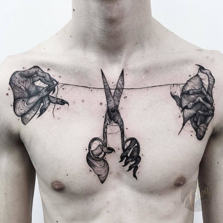 a man with tattoos on his chest has scissors and roses attached to the string that he is holding