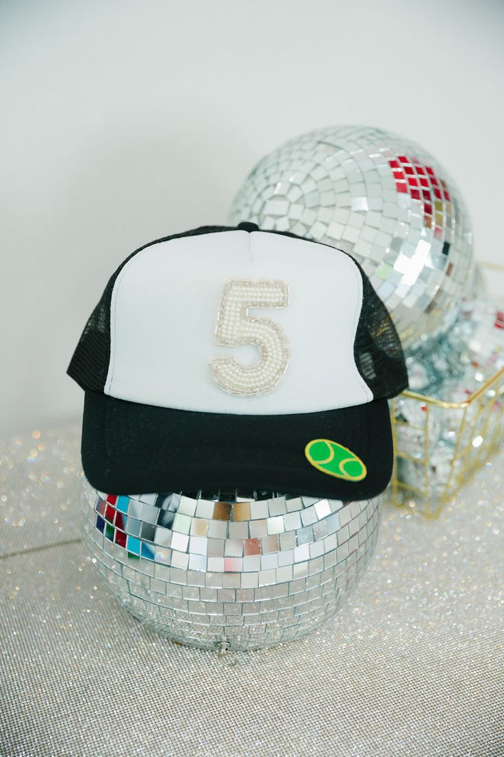 We are obsessed with these custom Judith March Beaded number hats! Whether you want your team number, enneagram, or favorite date, we will customize it for you. Number patches are only available in the White Beaded patch style. **If this product is purchased without adding/paying for custom numbers, your order will be cancelled. This item cannot be purchased plain.** Since this item is custom, we do not offer refunds, exchanges, or store credit. Once a custom order is placed, we are unable to ch