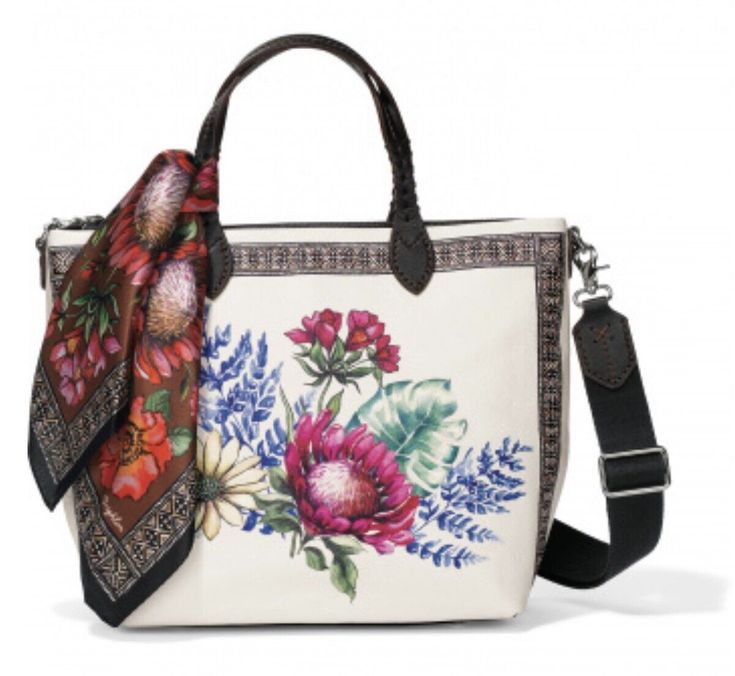 Brighton Palma large leather tote NWTs. Inspired by our designers' trip to Africa, this tote adds an exotic floral touch to your every day. We love its silk scarf, sporty, detachable long crossbody strap and top handles -- so ladylike! Zips close for security. Width: 14" Height: 11" Depth: 7" Strap: 4" Additional Strap: 12" - 23" Adjustable Top Closure: Ziptop Interior Pockets: 4 Exterior Material: Leather Interior Lining: Cotton Exterior Pockets: 1 Features: Key holder/Scarf/Feet CARE Keep all Trip To Africa, Brighton Purses, Accra Ghana, Jeans For Girls, Sunflower Daisy, Brighton Handbags, Brighton Bags, Shoes For Summer, Embroidered Tote