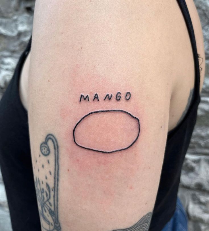 a woman's arm with the word mango written on it