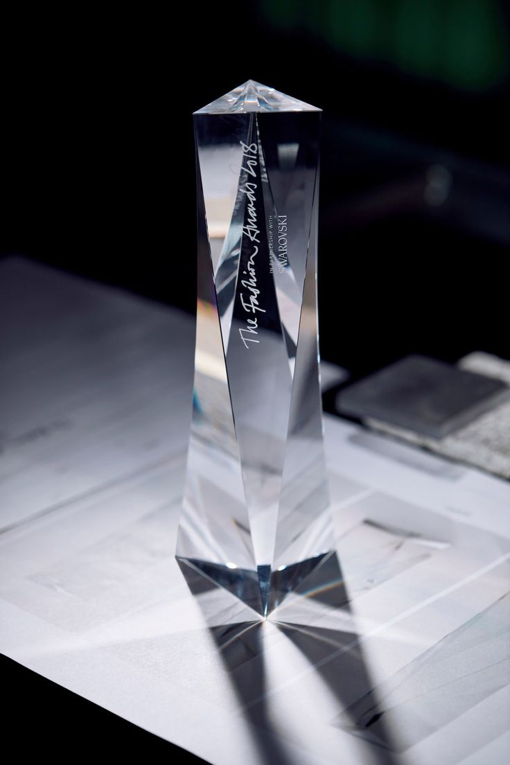 a crystal trophy sitting on top of a table