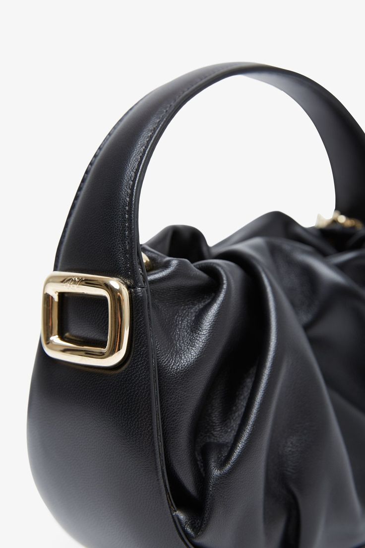 Black leather tote bag from Roger Vivier. The Viv' Choc hobo bag is made of nappa leather with a soft drape and can be carried by hand or crossbody with the removable shoulder strap. Measurements: L19 x H13.5 x W8 cmMade in Italy Black Hobo Bag, Black Leather Tote Bag, Black Leather Tote, Roger Vivier, Nappa Leather, Leather Tote Bag, Hobo Bag, Leather Tote, Shoulder Strap