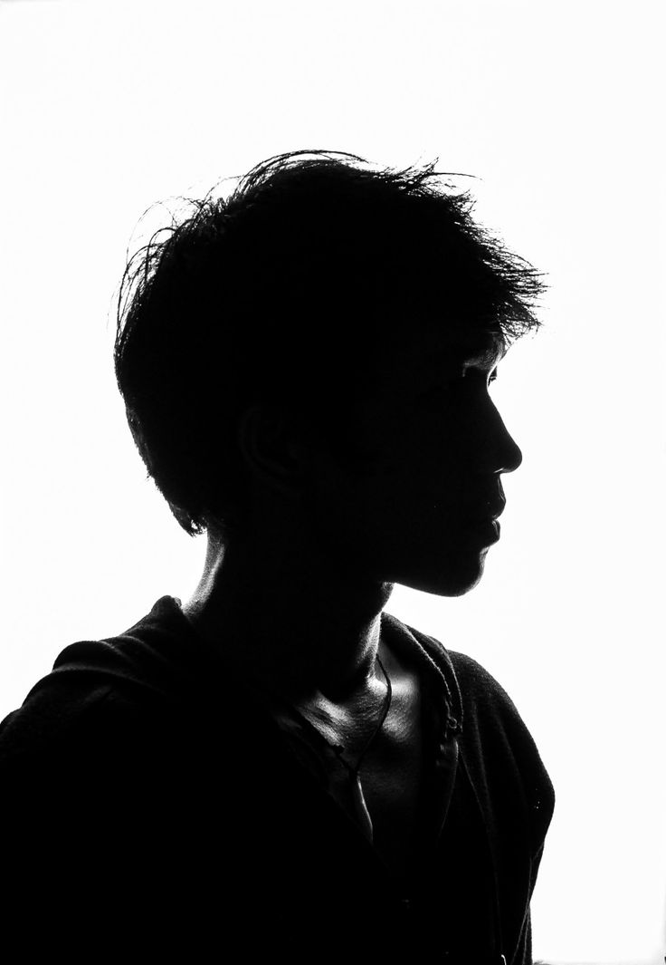 the silhouette of a person is shown in black and white, against a light background