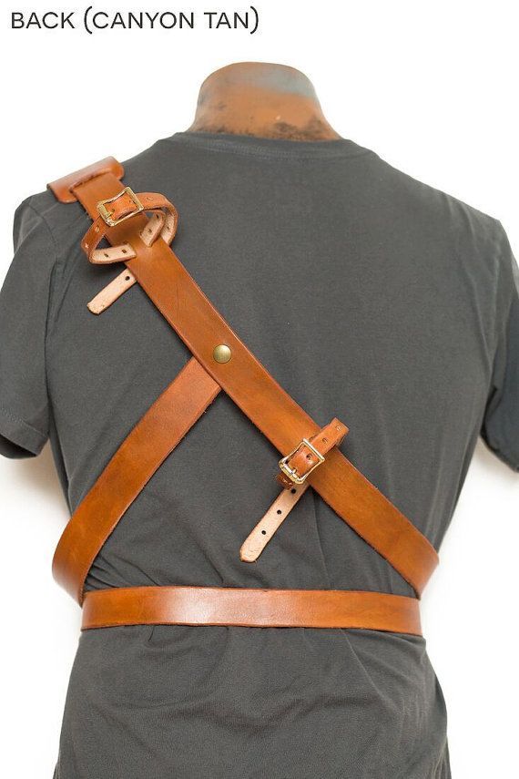 the back of a man's shirt with leather straps