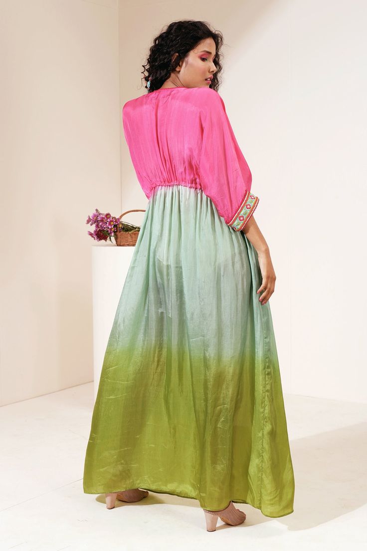 Pink, mint green shaded kaftan with embroidery on the neckline, bead tassels and drawstring at the waist. 
Component: 1
Pattern: Embroidery
Type Of Work: Thread
Neckline: V neck
Sleeve Type: Flared
Fabric: Habutai Silk
Color: Pink,Green
Other Details: 
Tie up at the waist
Occasion: Resort - Aza Fashions Festive Green Dress With Tassels, Festive Green Tassel Dress, Green Bollywood Tunic Dresses, Bollywood Style Pista Green Dress For Spring, Pista Green Bollywood Dress For Spring, Green Maxi Length Kaftan For Festivals, Green Maxi-length Kaftan For Festivals, Green Bollywood Style Maxi Length Kaftan, Green Bollywood Style Maxi Kaftan