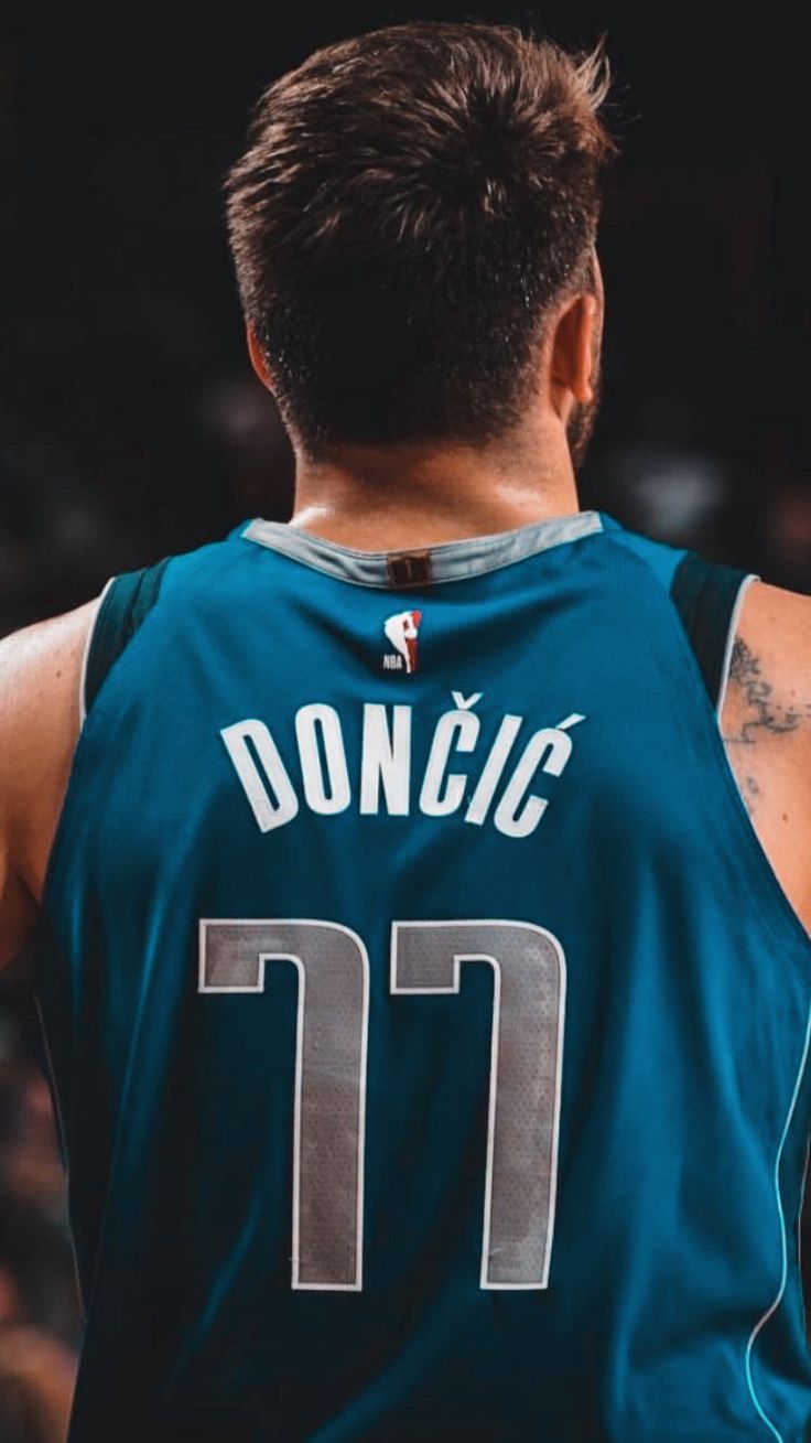 the back of a basketball player's blue jersey