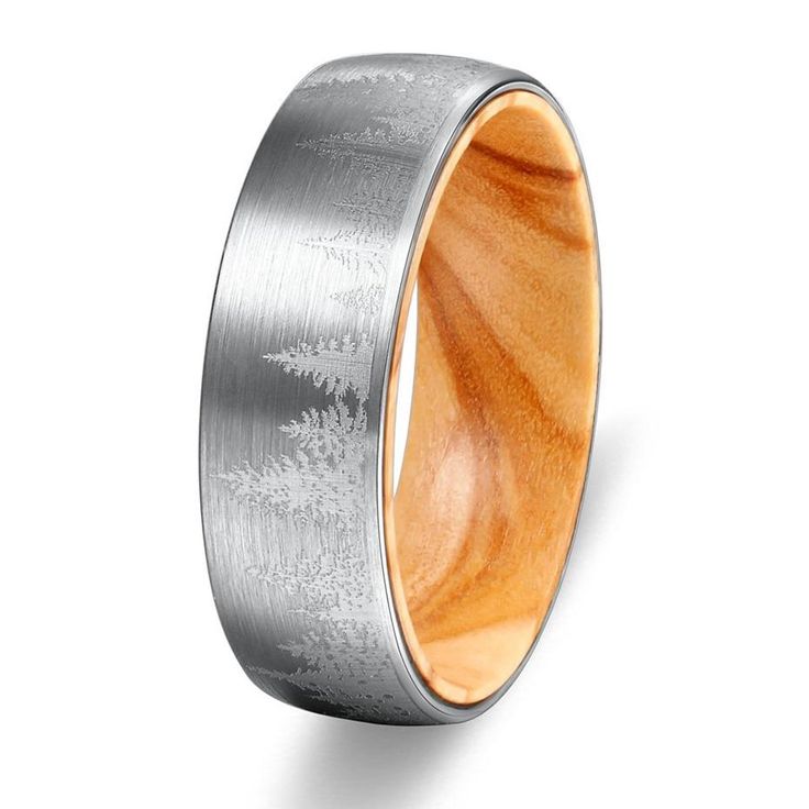 the men's wedding band is made from wood and silver with an etched design