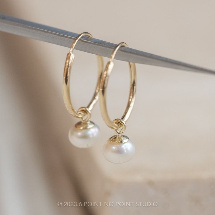 Freshwater Pearl Endless Earrings Each of these unique earrings feature a timeless freshwater pearl.The earrings are made of recycled 14k yellow gold. Metal Type: 14k Yellow GoldEco Friendly, Sustainable and Ethically Sourced: These earrings are eco friendly and made from sustainable sources because all the gold used is recycled and from non-mined sources. The diamonds are also 100% certified conflict free and ethically sourced.Shipping:These earrings will be packaged up and ready to ship in 2-5 Yellow Gold Small Hoop Pearl Earrings For Anniversary, 14k Yellow Gold Filled Earrings With Pearl Pendant, Yellow Gold Earrings With Pearl Pendant, 14k Gold Pearl Earrings For Everyday, 14k Gold Hoop Earrings With Pearl Drop For Weddings, 14k Gold Huggie Pearl Earrings For Anniversary, Minimalist Yellow Gold Pearl Earrings For Anniversary, Hypoallergenic Yellow Gold Pearl Earrings In 14k Gold Filled, Everyday 14k Gold Pearl Earrings With Ear Wire