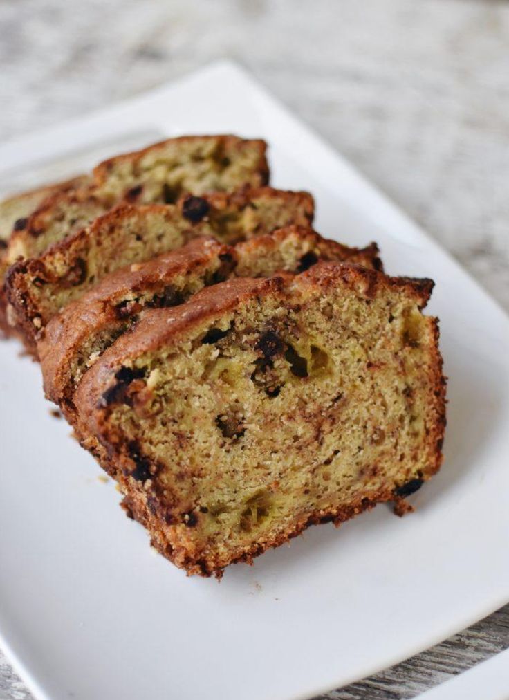 two slices of rhubarb banana bread on a white plate with text overlay