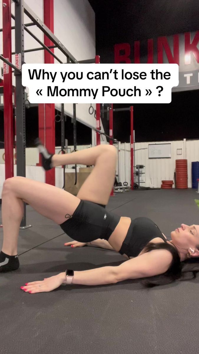 a woman laying on the ground with her leg up in front of her and text that reads, why you can't lose the mommy pouch?