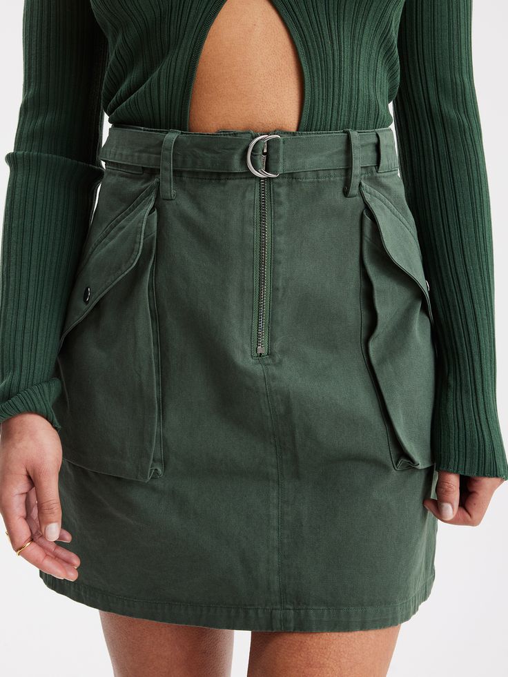 A cargo mini skirt from Holzweiler High Waist Mini Skirt With Cargo Pockets, Mini Skirt With Multiple Pockets, Mini Cargo Skirt With Multiple Pockets For Workwear, Workwear Mini Cargo Skirt With Multiple Pockets, Mini Cargo Skirt With Pockets For Work, Utility Mini Skirt With Cargo Pockets, Utility Mini Cargo Skirt With Belt Loops, High Waist Utility Cargo Skirt, Fitted Cargo Style Mini Skirt