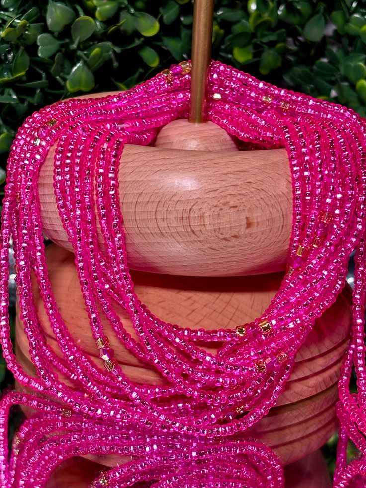 **Please allow up to 5-7 business days for processing time for Waistbeads, Free US Shipping for orders over $75 ** Our stunning Pink Diamond Waistbeads, are perfect for adding a touch of elegance and tradition to your style. These waistbeads feature a beautiful pink color, accented with splashes of gold beads and glass crystal beads throughout. Crafted with high-quality 8/0 and 6/0 glass beads, they offer both durability and beauty. Designed to fit most with a standard length of 60", these tradi Elegant Pink Round Beads, Elegant Pink Rondelle Beaded Necklaces, Elegant Pink Polished Beads, Elegant Pink Rondelle Beaded Necklace, Round Gemstone Beads For Party, Elegant Pink Beaded Necklace With Tiny Beads, Traditional Pink Jewelry With Tiny Beads, Elegant Pink Spacer Beads, Pink Polished Oval Beaded Necklaces