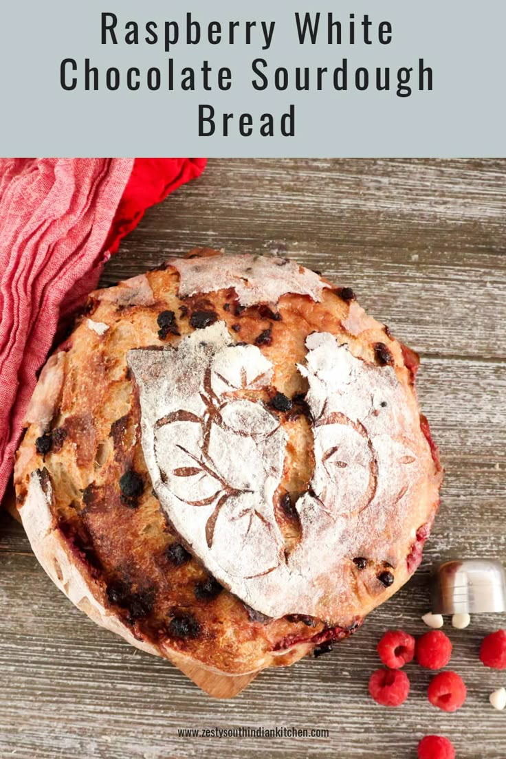 raspberry white chocolate sourdough bread on a wooden table