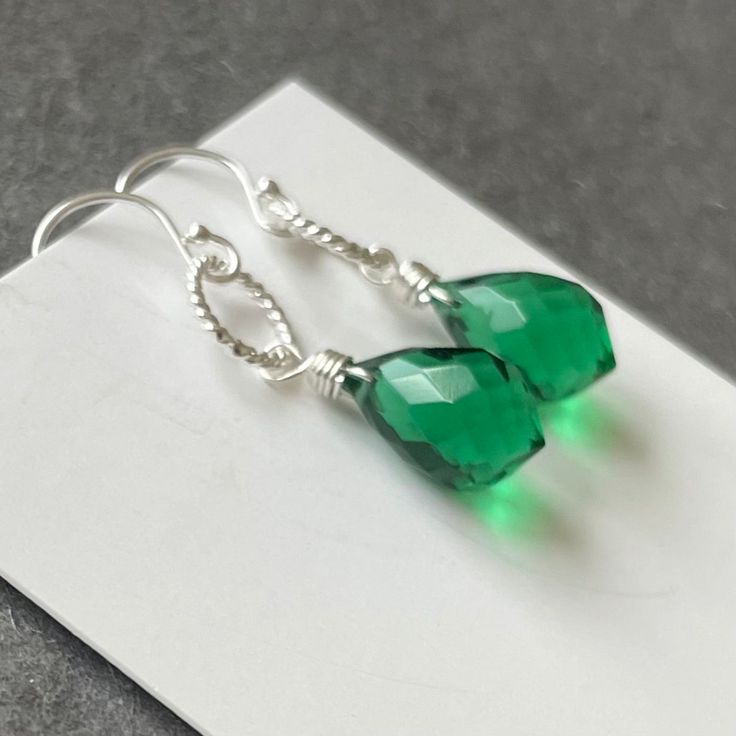 Fantastic plump dewdrop emerald green Quartz. The ultimate in color and sparkle. This stones is 12mm high, so it's not tiny. Sterling silver Hoop. Please choose your earwire ( options available exclusively at shirzay.com ) or the default French ball hook in sterling silver shown will be sent. APPRX. Length is 1 5/16”. Your jewelry will be beautifully giftboxed. Silver Hoop Earring, Colorful Jewelry, Green Quartz, Sterling Silver Hoops, Silver Hoops, Silver Hoop Earrings, Emerald Green, Emerald, Hoop Earrings