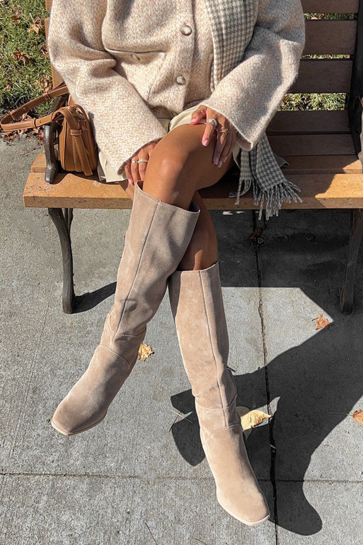 A one-step upgrade to your entire wardrobe. FYNN is a tall boot that elevates all your looks with a super-sleek silhouette you'll want to wear every. single. day. Pair her with cozy sweater dresses and breezy maxis alike this season. Suede Upper Synthetic Outsole Suede Lining Synthetic Sock 12.6" Shaft Height 3.0" Heel Height 14.3" Leg Circumference Please note leg circumference measurements are based on Size 6 measurements. Each size will measure 3mm difference. Maxi Dress With Boots Fall, Dolce Vita Shoes Outfit, Taupe Suede Boots Outfit, Boots Fall 2024, Beige Suede Boots Outfit, Sweater Dress With Boots, Suede Boots Outfit, Fall Dressing, Fall Boots Outfit