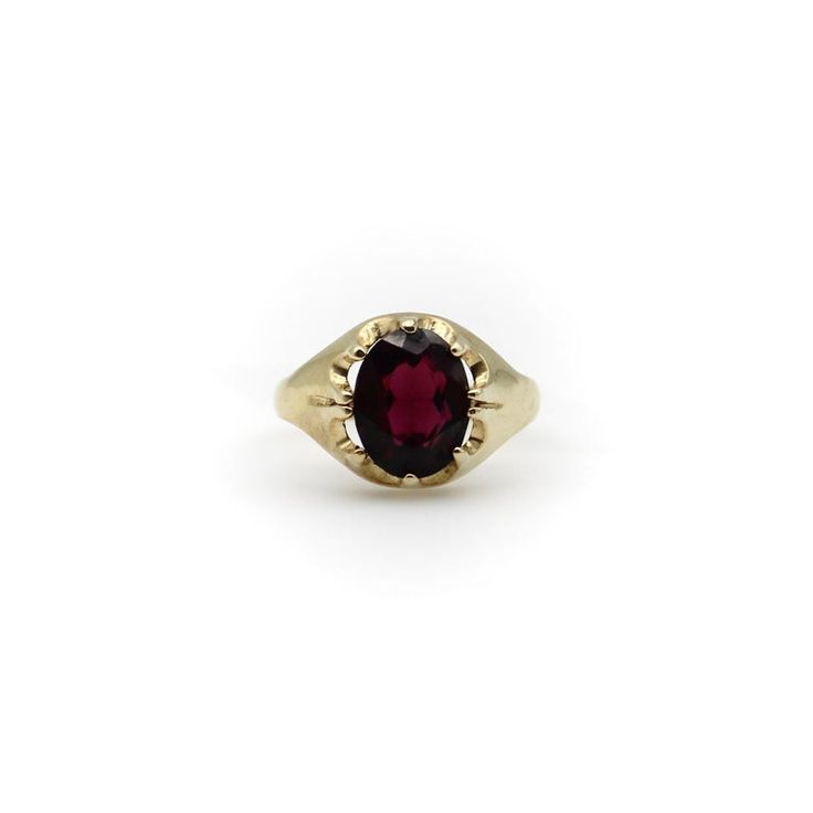 This is part of Chairish’s Fine Jewelry assortment.  This is a lovely 9K gold and rhodolite garnet ring. The ring is well marked—it contains the makers mark, the mark for London and the date letter for 1994. This ring was made by the Berker Brothers. The Berker Brothers is a family run business that specialises in wedding rings and was established in 1945. To this day, they remain one of the UK’s leading wedding ring manufacturers. This ring is a size 7 1/2, though it could be sized up or down. Classic Yellow Gold Garnet Rings, Classic Yellow Gold Garnet Birthstone Ring, Classic Garnet Birthstone Ring In Yellow Gold, Yellow Gold Garnet Signet Ring With Gemstone, Classic Garnet Signet Ring For Formal Occasions, Classic Garnet Birthstone Ring, Classic Garnet Birthstone Ring With Center Stone, Classic Garnet Signet Ring For Anniversary, Classic 14k Gold Ruby Birthstone Ring