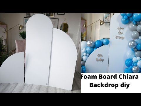 a room decorated with balloons and surfboards on the wall, along with an advertisement for foam board chair back drop diy