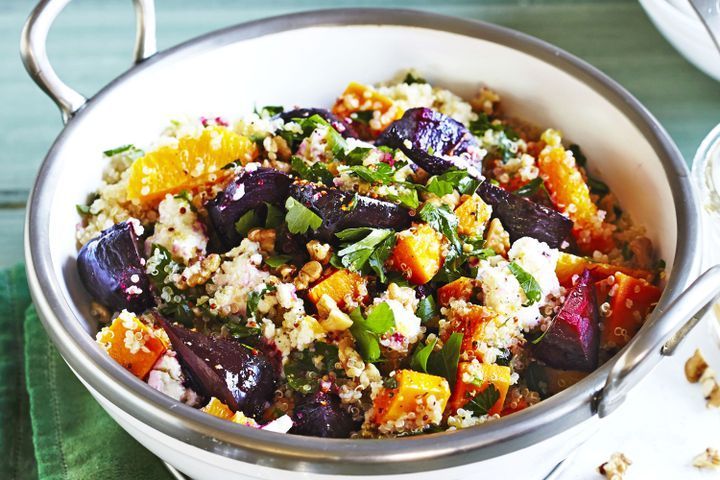 a white bowl filled with food on top of a table