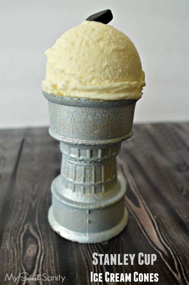 an ice cream cone sitting on top of a wooden table with the words stanley cup ice cream cones above it