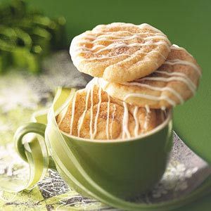 two cookies are stacked in a green cup