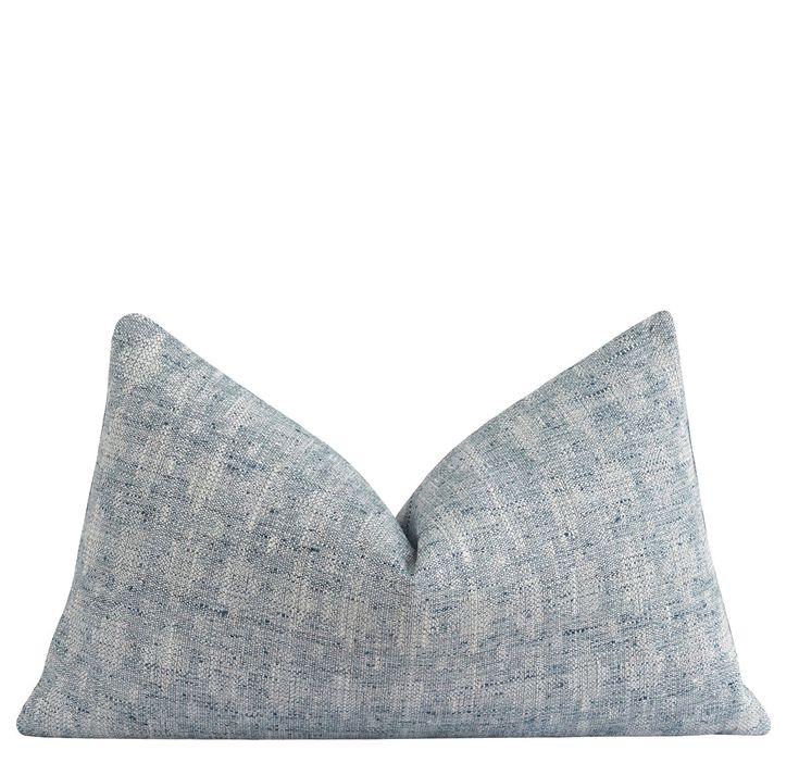 a blue pillow on a white background