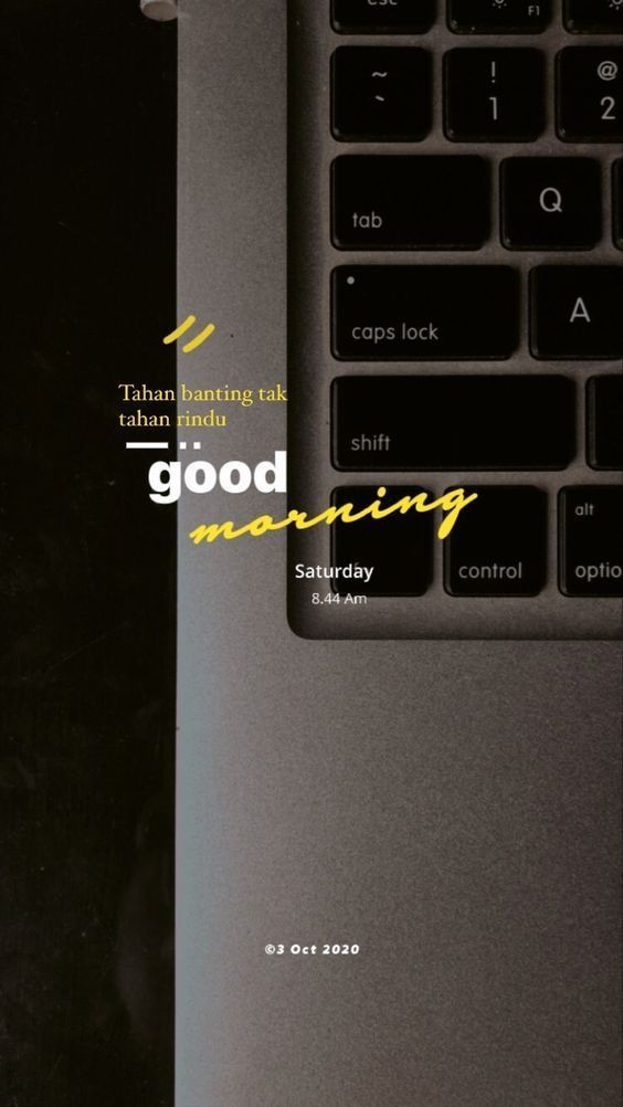 a laptop computer sitting on top of a desk with the words good morning next to it