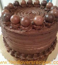 a cake with chocolate frosting and decorations on top