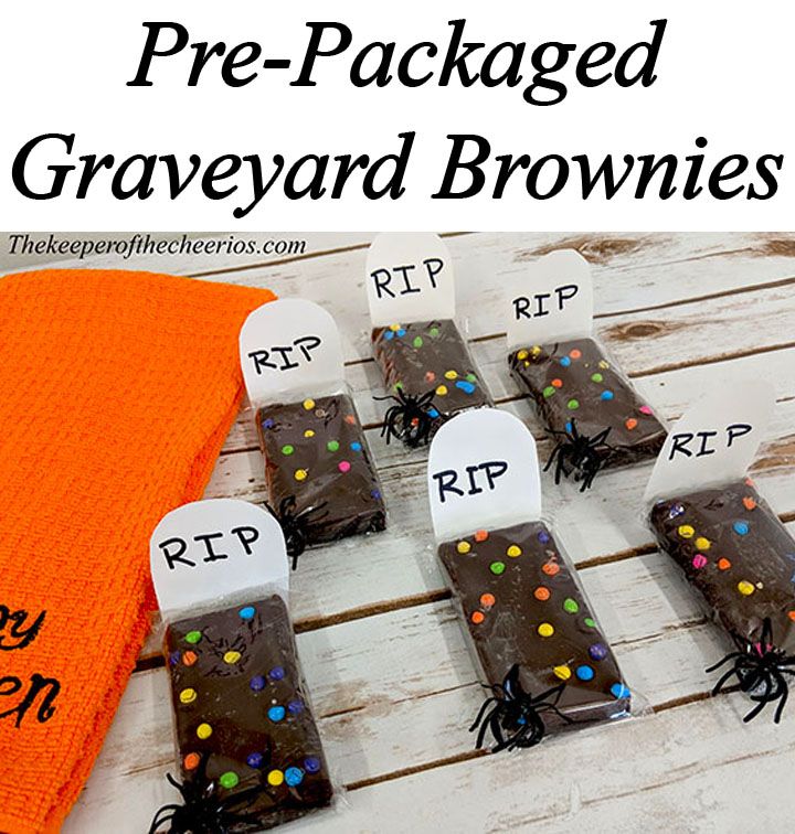 chocolate pre - packaged graveyard brownies are arranged on a table with an orange towel