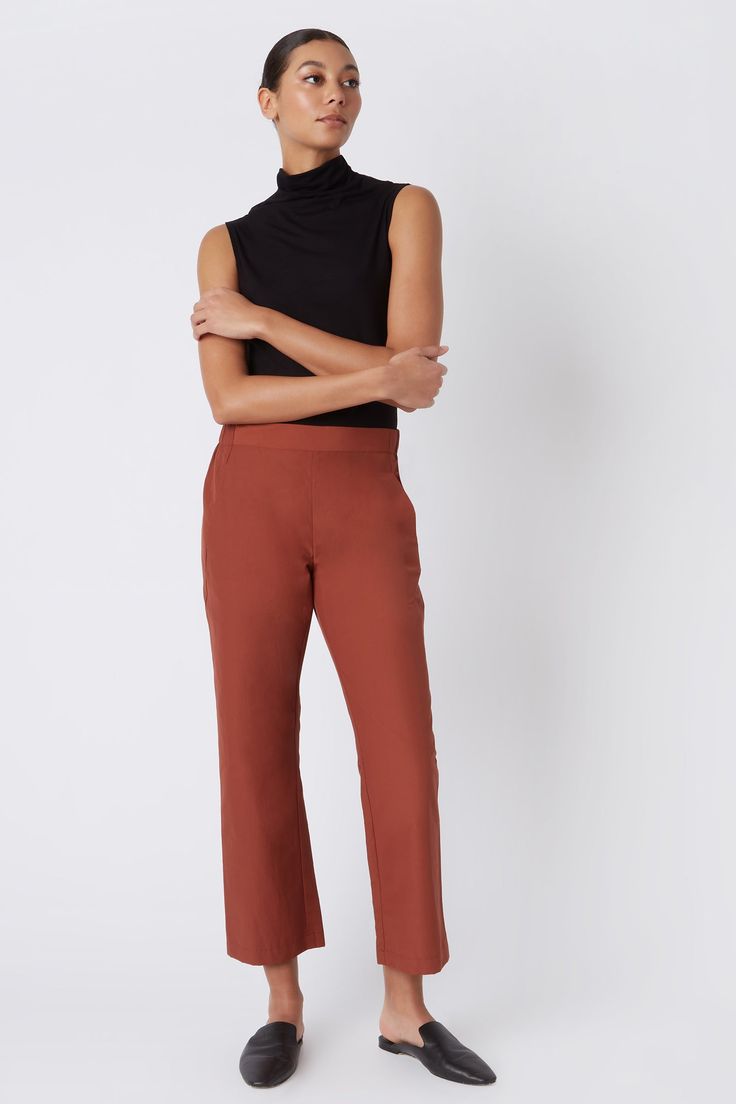 Fall calls for ease with our elastic waist Brit Crop Pant. With a mid-rise fit, angle seam pockets and the perfect leg opening, this style is a breeze to wear in the cooler weather. Pair it with your favorite ankle boot or sneaker, this style is designed for women on the go.THIS ITEM IS FINAL SALE. 1.5" front waistband, elastic at sides and back, angle seams with front pockets, midrise, easy fit, clean finish hem. - 51% Cotton, 49% Nylon - Fabric Woven in Italy - Made in NYC - Professional dry c Pull-on 4-way Stretch Dress Pants For Work, Business Casual Straight Dress Pants With Pull-on Style, Fitted Straight Pants With Pull-on Style, Stretch Tapered Leg Dress Pants With Pull-on Style, Stretch Tapered Leg Pull-on Dress Pants, Business Casual Wide Leg Pull-on Bottoms, Versatile Straight Leg Pants With Comfort Stretch, Straight Pants With Pull-on Style And 4-way Stretch, Versatile Tapered Leg Dress Pants With 4-way Stretch