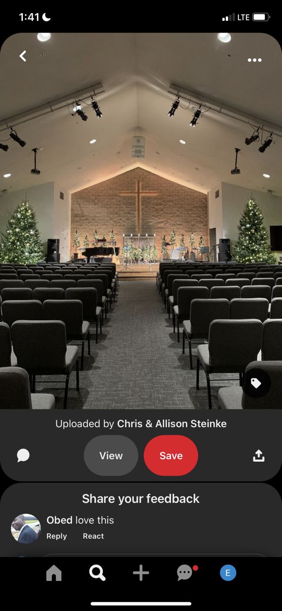 an image of the inside of a church with lights on and chairs set up in rows