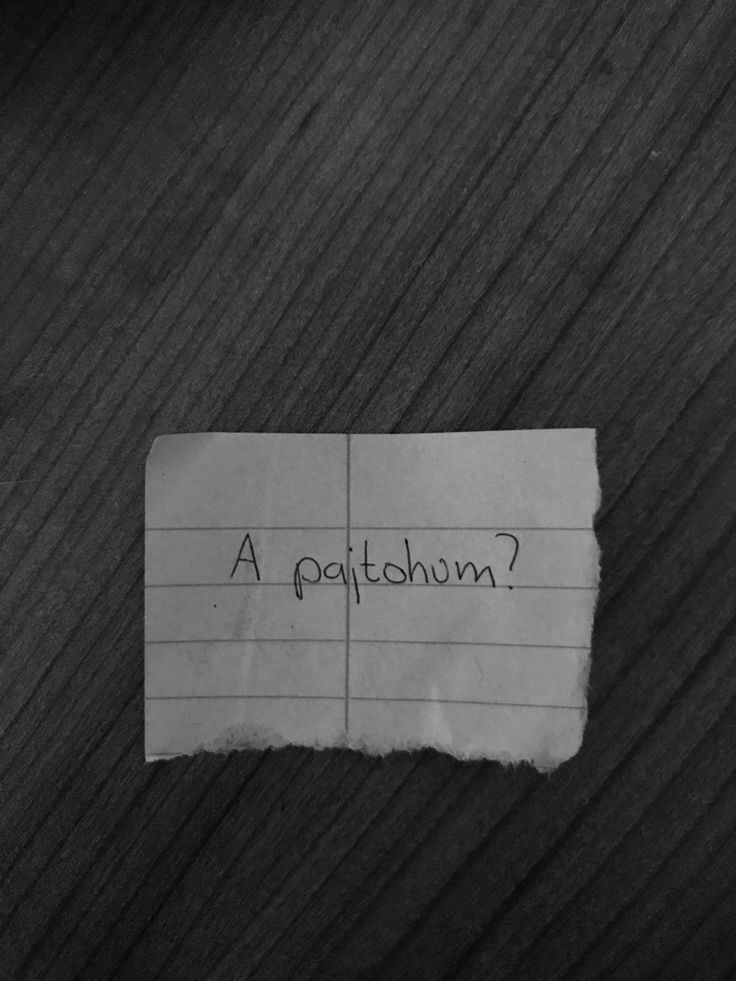 a piece of paper with the words a patchinn written on it sitting on top of a wooden table