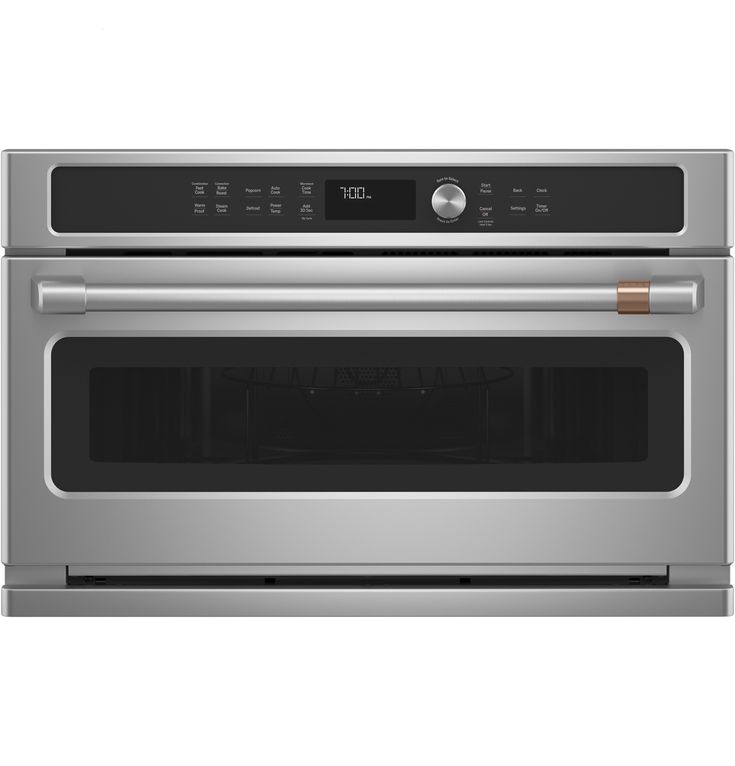 a stainless steel oven with the door open and its electronic controls on it's side