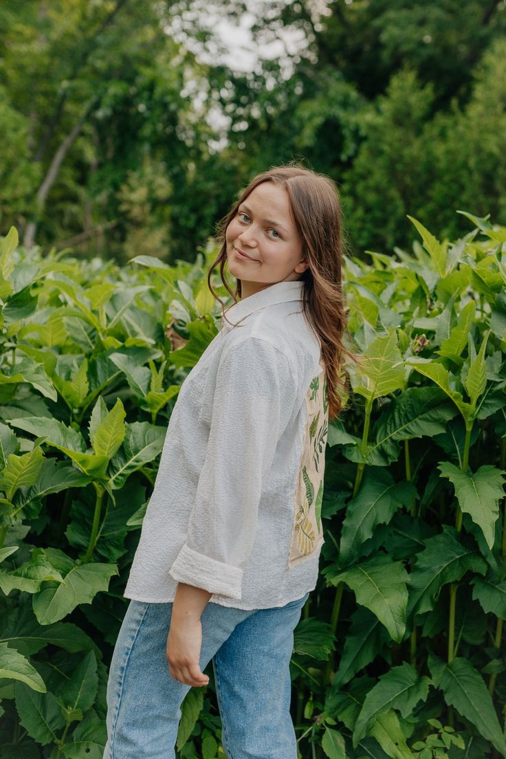 Where the lovers of plants, greenery and neutrals can come together and obsess over this button up! Wear it oversized or buttoned up, it can with so many outfits & is a perfect addition to a pair of jeans for a minimal, but still unique, outfit! This button upon was thrifted, patched and painted! This piece is one of a kind and was thrifted then patched and painted! Since this is a hand painted piece it may crack after multiple washes, but is safe to wash on delicate cycle & safe to go in the dr Spring Botanical Shirt With Relaxed Fit, Botanical Style Relaxed Fit Spring Shirt, Botanical Relaxed Fit Spring Shirt, Casual Long Sleeve Tops For Garden Party, Everyday Green Shirt For Spring, Vintage Button-up Spring Jeans, Bohemian Button-up Tops With Buttons, Bohemian Button-up Outerwear With Buttons, Spring Patchwork Button-up Shirt